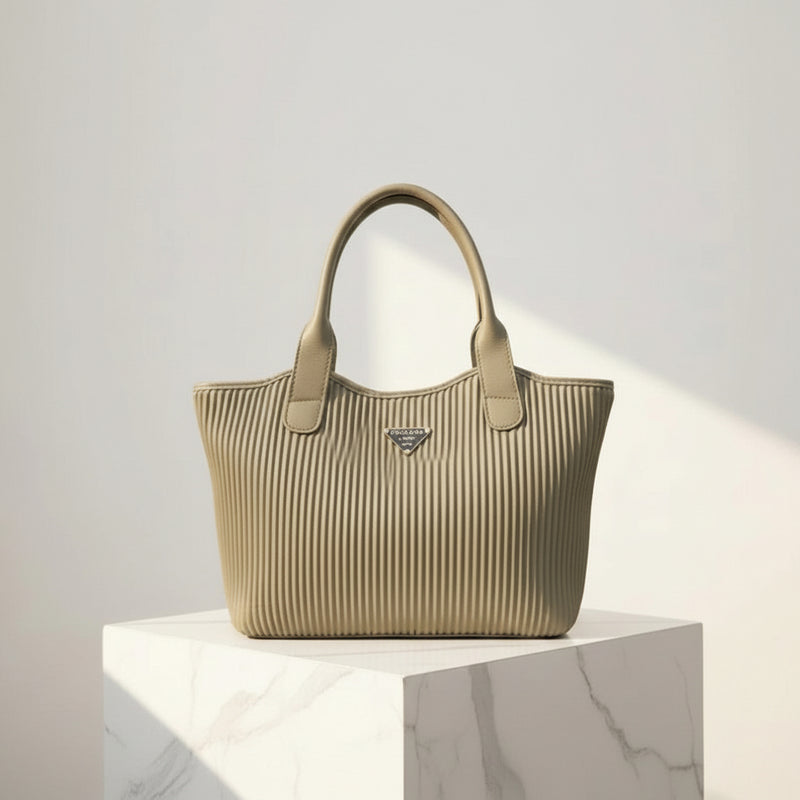 Beige handbag with a brand logo on a light gray background At Aezoon