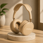 Beige headphones on a marble stand with a plant in the background