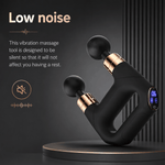 Black and gold vibration massage tool with digital display on a dark background