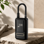 Black digital lock on a stone surface with a neutral background