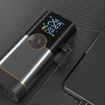 Black electronic device with digital display and USB cable on a dark surface At Aezoon