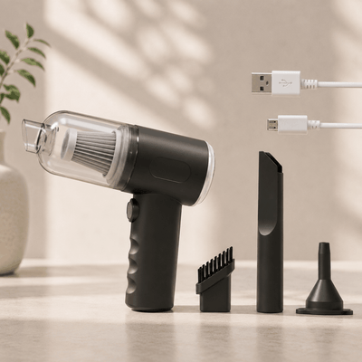 Black handheld vacuum cleaner with attachments on a neutral background