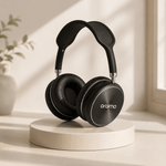 Black headphones on a white pedestal with a light background