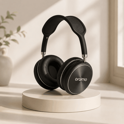 Black headphones on a white pedestal with a light background
