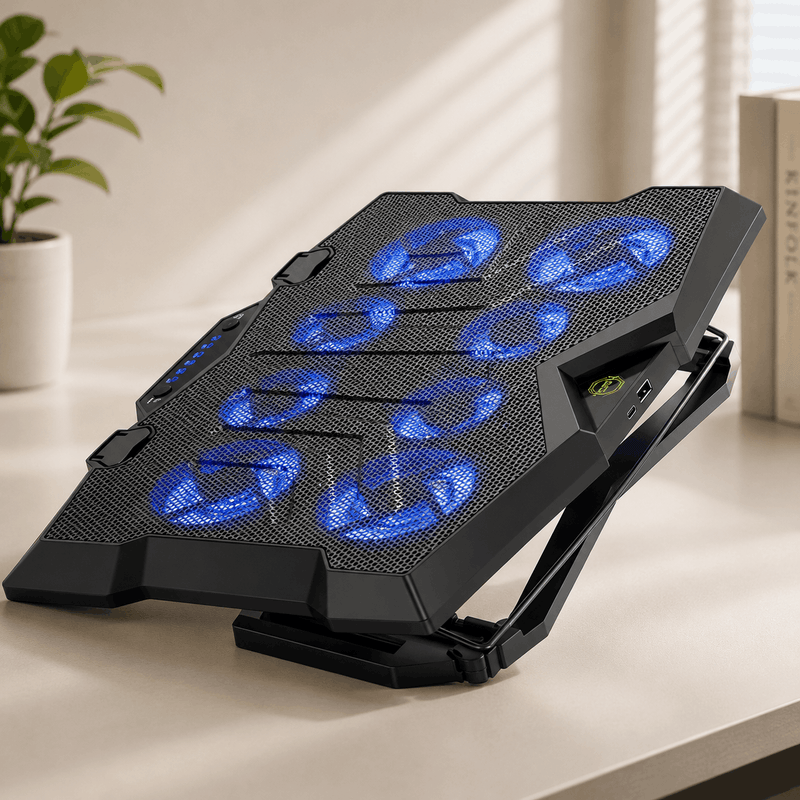 Black laptop cooling pad with blue LED lights on a desk