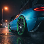 Blue car with green rims on a wet street at night At Aezoon
