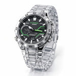 Casio watch with silver strap and green digital display on a white background At Aezoon