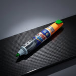 Colorful marker on a textured black surface at Aezoon