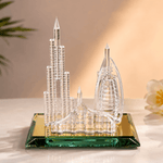 Crystal architectural model on a reflective surface with a soft background