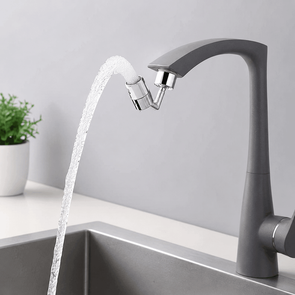 Gray faucet with water flowing into a sink against a light gray background