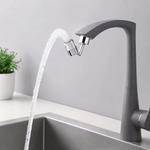 Gray faucet with water flowing into a sink against a light gray background