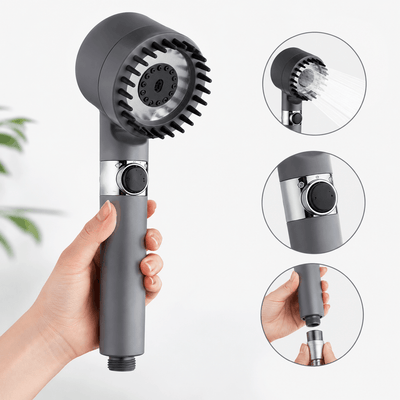 Handheld shower head with detachable nozzle held by a hand, on a light background.