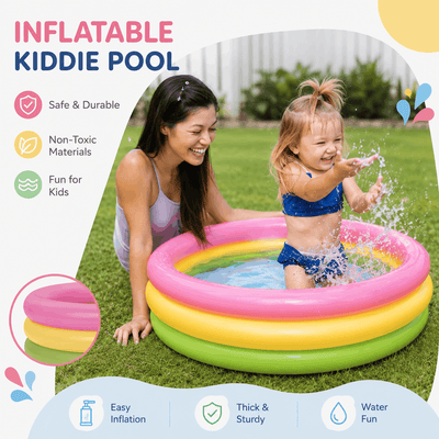 Happy toddler splashing water in a 3-ring blow-up pool with mother watching