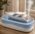 Humidifier shaped like a yacht on a wooden surface with steam rising