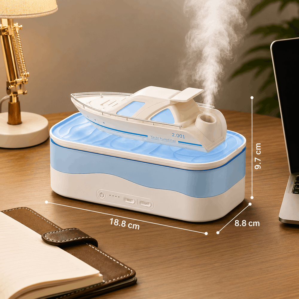 Humidifier with steam release on a desk next to a laptop and lamp.