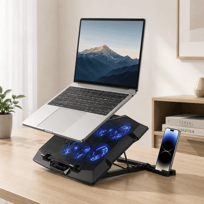 Laptop on a cooling stand with blue LED lights on a desk