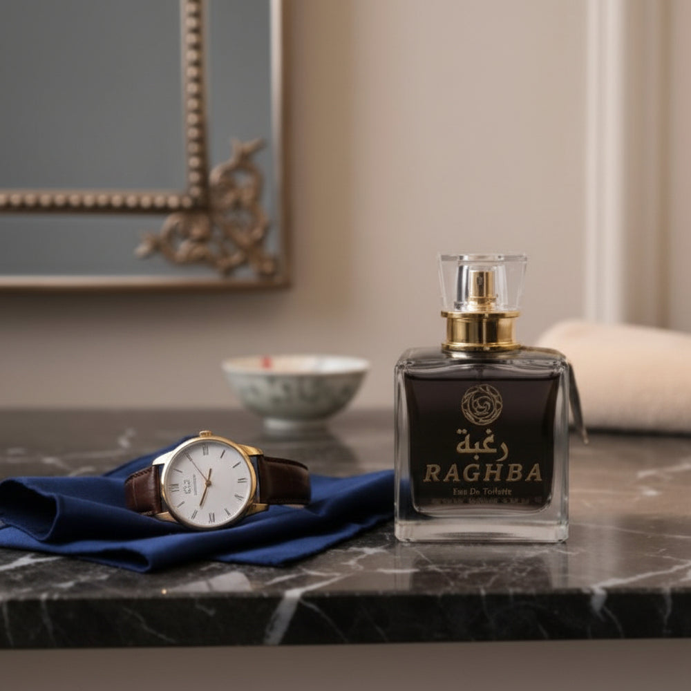 Perfume bottle labeled 'Ragha' on a marble surface with a watch and decorative items. At Aezoon