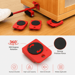Red furniture moving glides with 360-degree rotation feature on a wooden floor.