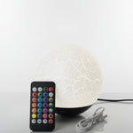 White LED night light with remote control on a white background