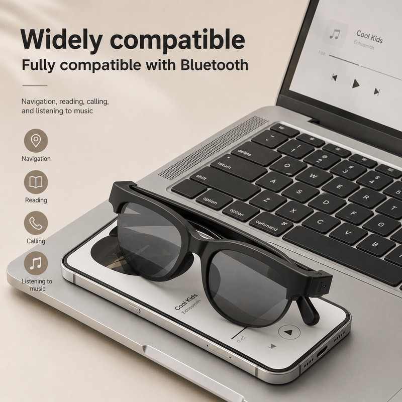 Sunglasses on a smartphone with a laptop in the background, emphasizing Bluetooth compatibility.