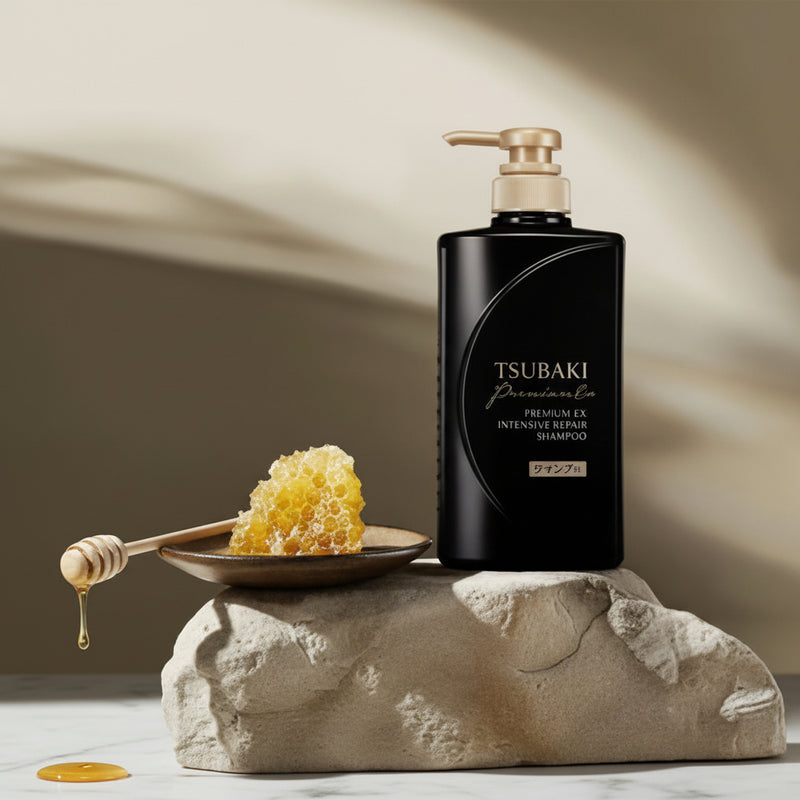 Tsubaki hair care product with honey on a stone surface At Aezoon