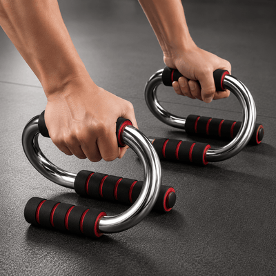 Two hands gripping metal rings with red accents on a dark surface