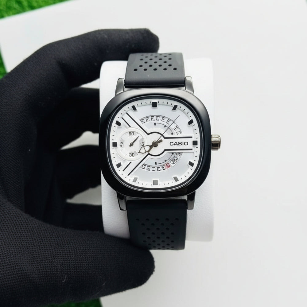 Watch with black strap and white face held by a gloved hand on a light background At Aezoon